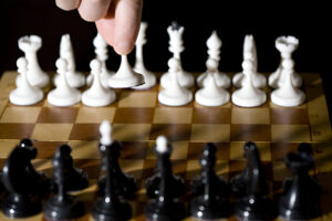 The Hidden Cost of Ascension on the Chessboard of Life